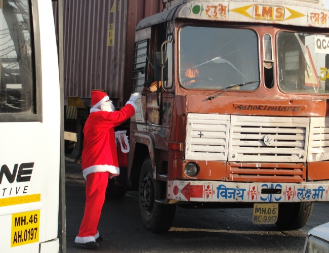 Santa Claus Giving Gift to Driver